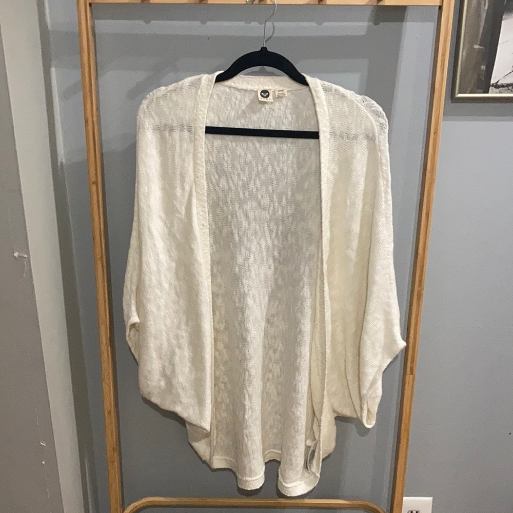 Ivory Roxy shrug.  Lightweight with low arms and long back.